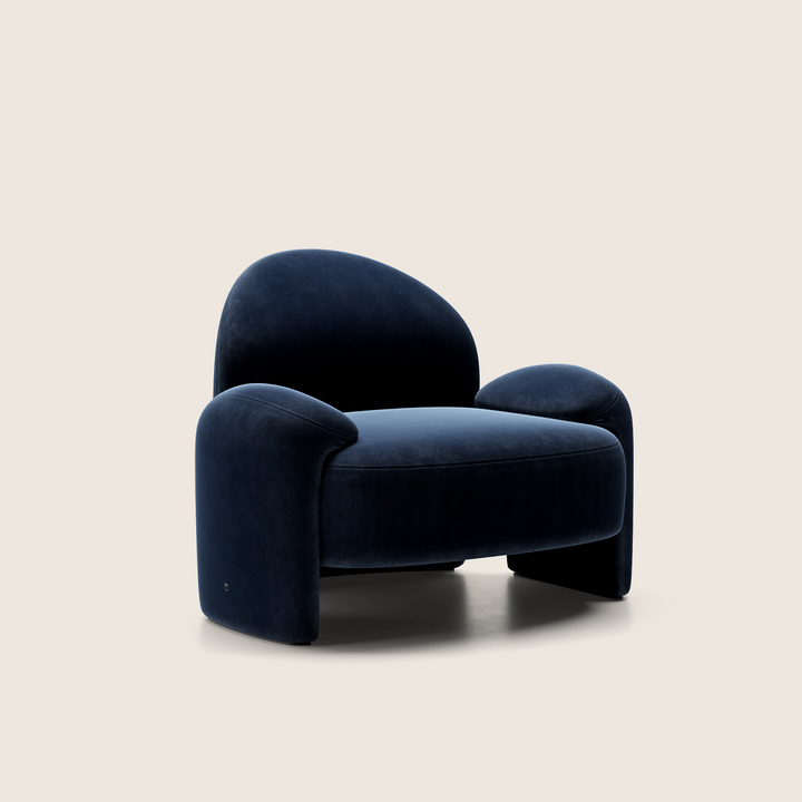 Navy blue armchair on a beige background